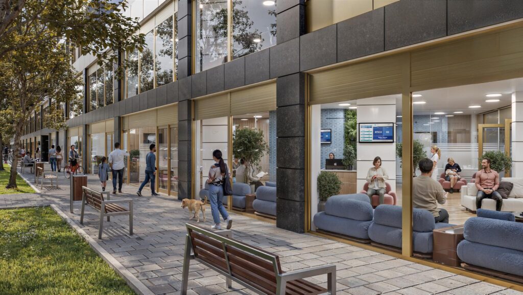 Moderne gevel van een gezondheidscentrum aan de H.J.E. Wenckebachweg met grote ramen en zicht op een wachtruimte binnen.